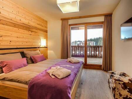 Slaapkamer van een appartement op Landal Alpine Lodge Lenzerheide
